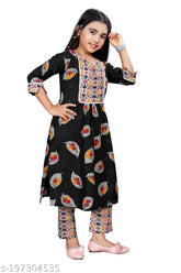Rayon print kurta set for girls, straight top with three-quarter sleeves and trousers bottom, available in sizes from 4-5 years to 13-14 years. Indian clothing design for children
